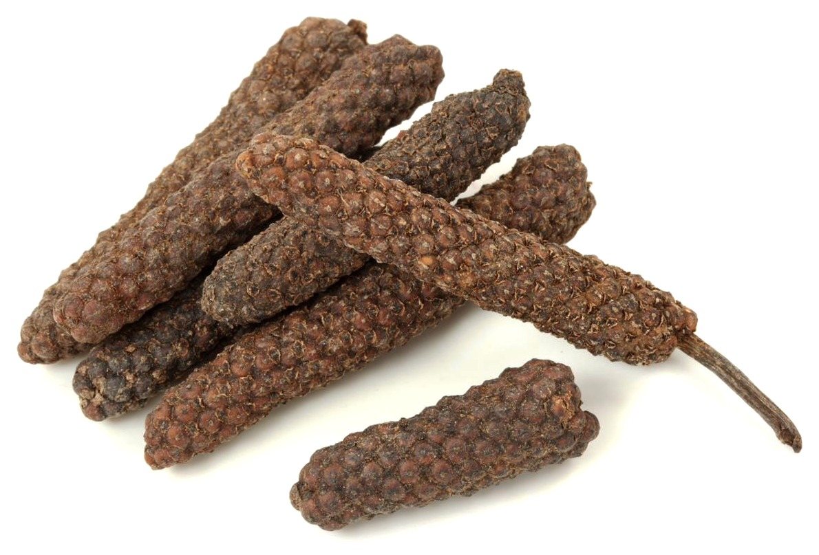 A small heap of long pepper catkins
