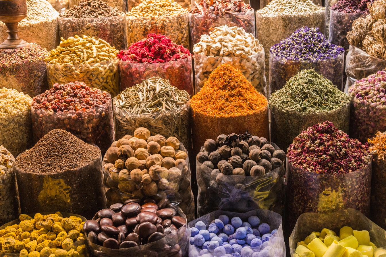Sacks of spices and dried flowers at a spice market
